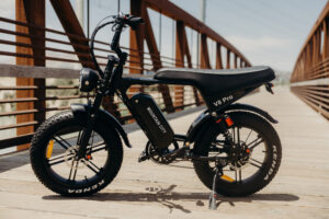 Electric bicycle parked, featuring a sleek frame, battery pack, and pedal-assist motor.