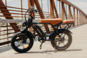 Electric bicycle parked, featuring a sleek frame, battery pack, and pedal-assist motor.